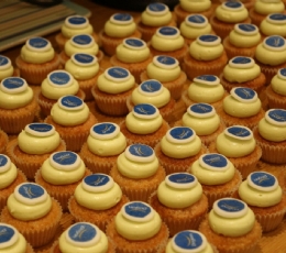 cupcake Dogan holding logo